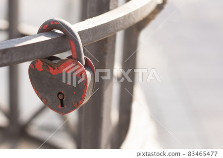 Rusty lock is like a heart 83465477