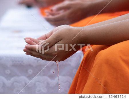 This is rite sprinkle water onto a monk , Buddha image on Songkran festival Thailand This is rite sprinkle water onto a monk , Buddha image on Songkran festival Thailand 83465514