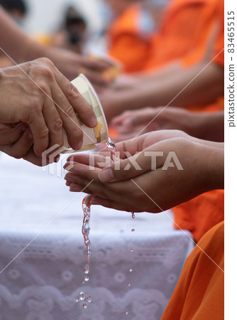 This is rite sprinkle water onto a monk , Buddha image on Songkran festival Thailand 83465515
