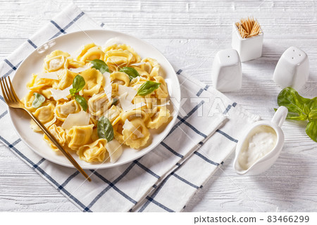 tortelloni with cheese filling on a plate tortelloni with cheese filling on a plate 83466299