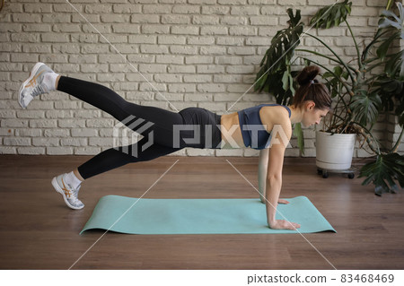 woman working out at home. woman working out at home. 83468469