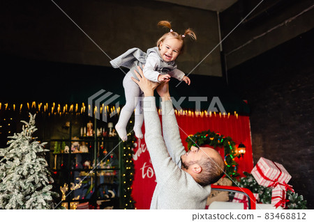 Dad Playing with Child on Christmas background Dad Playing with Child on Christmas background 83468812