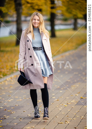 Woman in autumn park Woman in autumn park 83468821