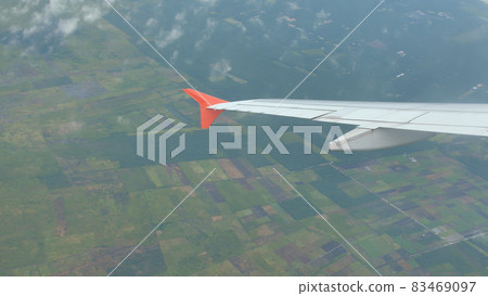 Flight of the aircraft over the agricultural fields of Indonesia. 83469097