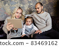 Family calling to friends with online 83469162
