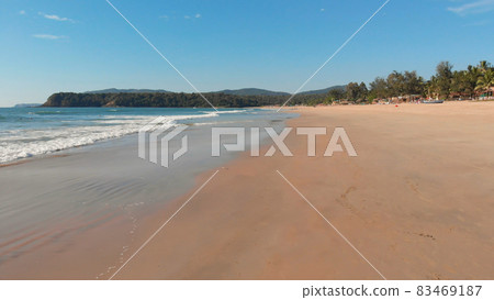 Low drone flight over the waves of Agonda beach. Goa State. India. Low drone flight over the waves of Agonda beach. Goa State. India. 83469187