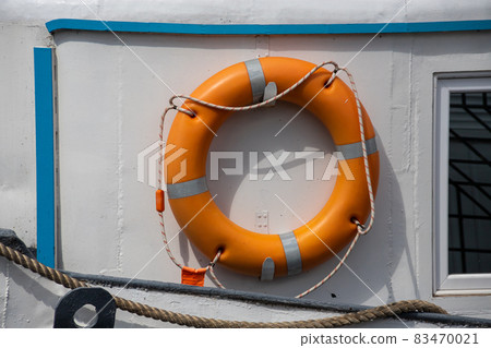 Lifebelt with lifeline on a white background on a ship 83470021