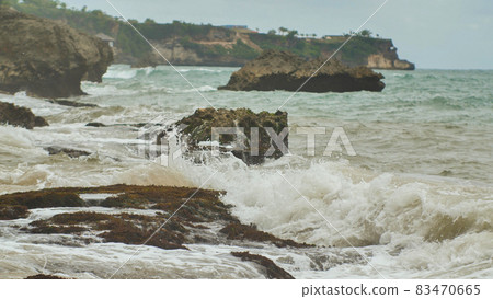 Slow mtion stony and rocky shore with strong waves and wind near Bali island. Tegal Wangi beach. Indonesia. Slow mtion stony and rocky shore with strong waves and wind near Bali island. Tegal Wangi beach. Indonesia. 83470665
