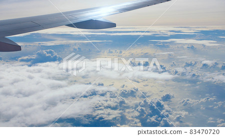 Storm clouds and part of the wing of the aircraft window. 83470720