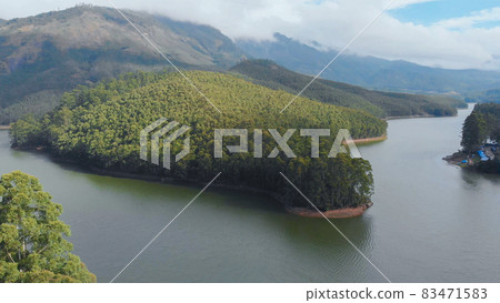 Aerial view beautiful nature with mountains and hills by Lake Mattupetty. Kerala State. Near the city of Munar. 83471583