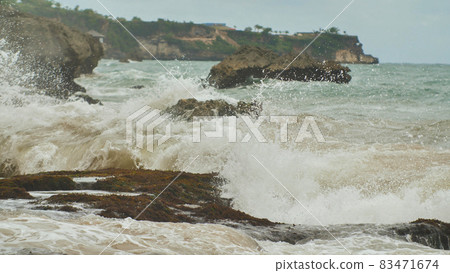 Slow mtion stony and rocky shore with strong waves and wind near Bali island. Tegal Wangi beach. Indonesia. Slow mtion stony and rocky shore with strong waves and wind near Bali island. Tegal Wangi beach. Indonesia. 83471674