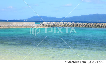 Blue sea and breakwater seen from the port of Taketomi Island Blue sea and breakwater seen from the port of Taketomi Island 83471772