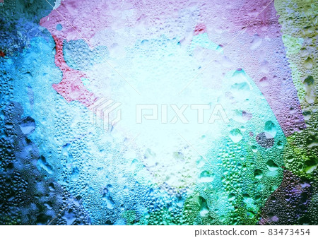 Abstract background of colorful water droplets on window glass 83473454