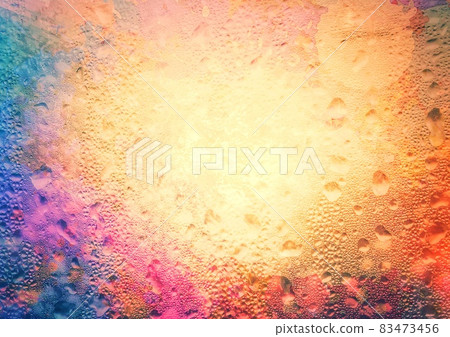 Abstract background of colorful water droplets on window glass 83473456