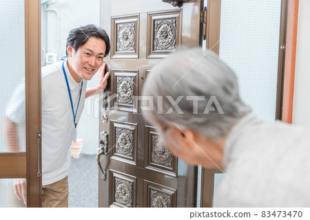 A man visiting an elderly housing A man visiting an elderly housing 83473470