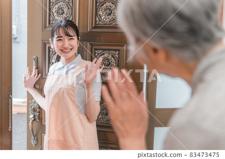 Women visiting elderly housing Women visiting elderly housing 83473475