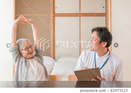 Cheerful elderly female and male staff (smiles) 83473525