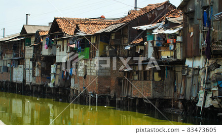 Slum area on the riverbank in Jakarta. Indonesia. Slum area on the riverbank in Jakarta. Indonesia. 83473605