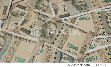 Indian money with 500 rupee bills in unfolded form. 83473619