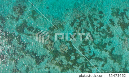 Aerial view of the beautiful ocean floor with reefs near Pantai Pandawa. Indonesia. Aerial view of the beautiful ocean floor with reefs near Pantai Pandawa. Indonesia. 83473662