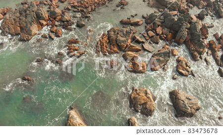 Aerial view rocks and stones on the Arambol beach in North Goa, India. 83473678