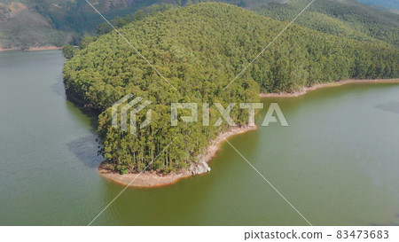 Aerial view beautiful nature with mountains and hills by Lake Mattupetty. Kerala State. Near the city of Munar. 83473683