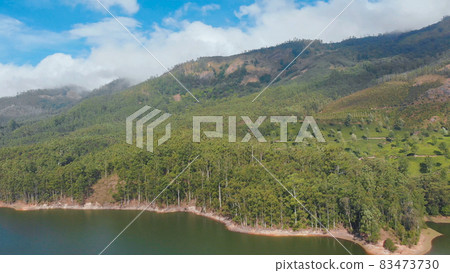 Aerial view beautiful nature with mountains and hills by Lake Mattupetty. Kerala State. Near the city of Munar. 83473730