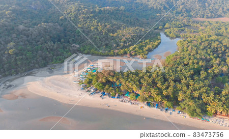 The beautiful nature of the state of Goa near the Palole beach at sunset and fishing boats. India. Drone view. The beautiful nature of the state of Goa near the Palole beach at sunset and fishing boats. India. Drone view. 83473756