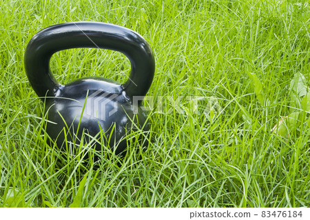 heavy iron kettlebell in grass heavy iron kettlebell in grass 83476184