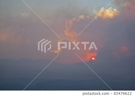 wildfire smoke over Rocky Mountains 83476622