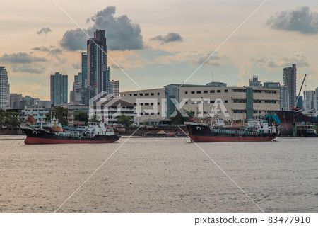 Two cargo ship parked in the middle of the Chao Phraya River. Two cargo ship parked in the middle of the Chao Phraya River. 83477910