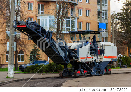 Asphalt milling and grinding machine at road repair site Asphalt milling and grinding machine at road repair site 83478901