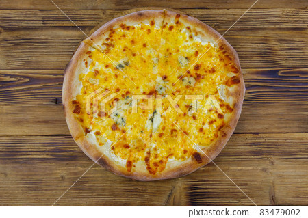 Pizza Four cheese on a wooden background. Top view Pizza Four cheese on a wooden background. Top view 83479002