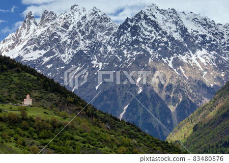landscape with orthodox church on a hillside background of snow-capped mountains in Mestia, Georgia landscape with orthodox church on a hillside background of snow-capped mountains in Mestia, Georgia 83480876