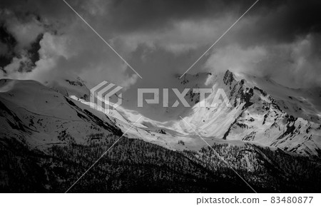 landscape photo snowy mountain top a sunny and covered with clouds, Mestia, Georgia landscape photo snowy mountain top a sunny and covered with clouds, Mestia, Georgia 83480877