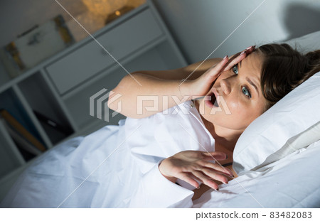 Worried young woman is oversleep on bed in bedroom 83482083