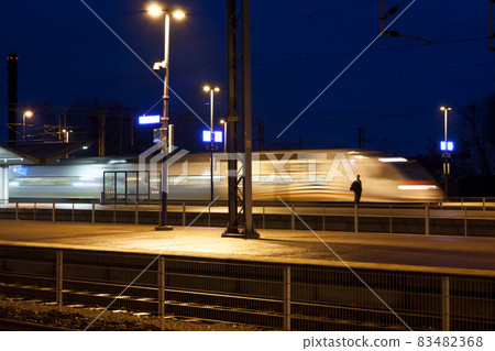 KOUVOLA, FINLAND - NOVEMBER 8, 2018: Allegro train in motion at the station at night, long exposure photo. 83482368