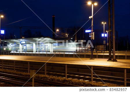 Train in motion on the station at night, long exposure photo. 83482937
