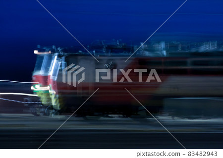 Train in motion on the station at night, long exposure photo. Train in motion on the station at night, long exposure photo. 83482943