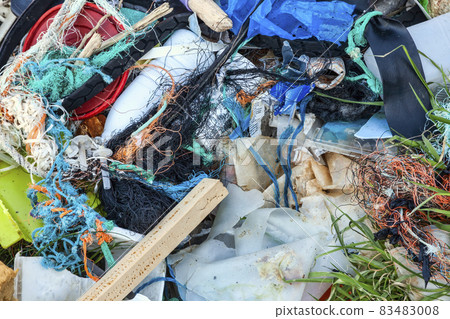 Plastic garbage waste with entangled fishing nets Plastic garbage waste with entangled fishing nets 83483008