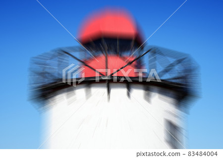 Old 19th century Georgian lighthouse at Burry Port, Carmarthenshire Wales UK with a zoom burst blur effect Old 19th century Georgian lighthouse at Burry Port, Carmarthenshire Wales UK with a zoom burst blur effect 83484004