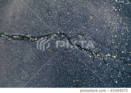 Cracked asphalt Cracked asphalt 83484075