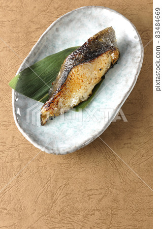 A bird's-eye view of the grilled sablefish, which looks delicious with fat on it. A bird's-eye view of the grilled sablefish, which looks delicious with fat on it. 83484669