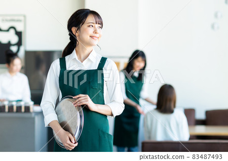 Young lady of cafe staff Young lady of cafe staff 83487493