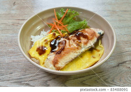 grilled salmon with egg dressing teriyaki sauce topping on Japanese rice in bowl grilled salmon with egg dressing teriyaki sauce topping on Japanese rice in bowl 83488091