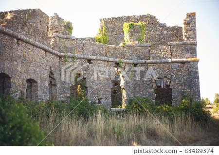 Empty decaying castle in forest 83489374