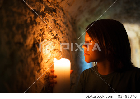 Courageous little boy exploring old castle Courageous little boy exploring old castle 83489376