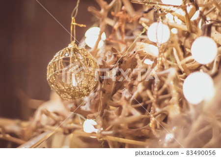 Light bulb decor in party . abstract christmas tree in golden ligh 83490056
