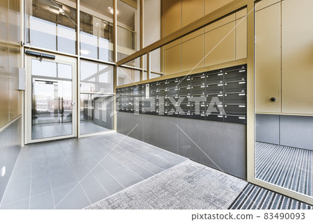 Interior of stylish building entrance with mailboxes 83490093