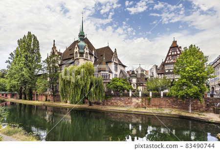 The building of International Lyceum of Pontonniers on the bank of the Ill river in Strasbourg, France 83490744